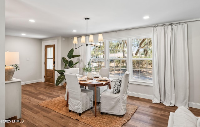 dining area with an inviting chandelier, wood finished floors, and recessed lighting