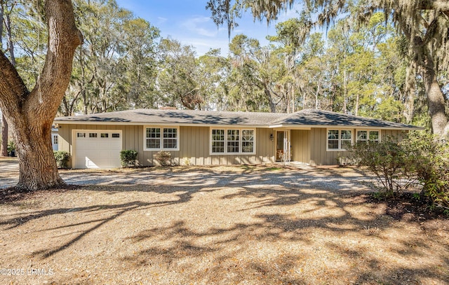 ranch-style house with driveway and an attached garage