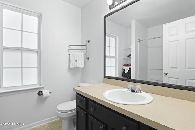 22 Sandy Pointe Dr, Bluffton, SC 29910 - full bath featuring vanity, toilet, baseboards, tile patterned flooring, and a shower