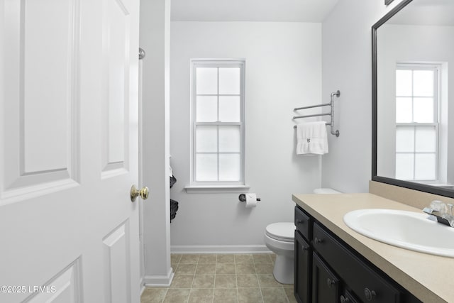 22 Sandy Pointe Dr, Bluffton, SC 29910 - bathroom with toilet, vanity, healthy amount of natural light, and baseboards