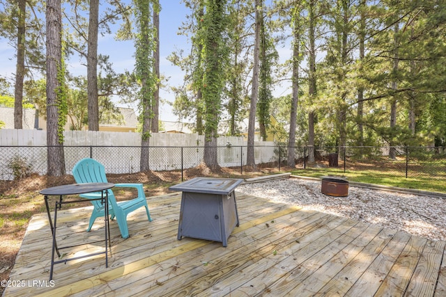 22 Sandy Pointe Dr, Bluffton, SC 29910 - wooden terrace with a fire pit and a fenced backyard