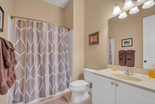 bathroom with curtained shower, tile patterned flooring, vanity, a notable chandelier, and toilet