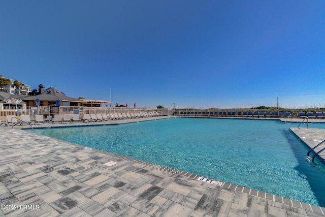 view of swimming pool featuring a patio