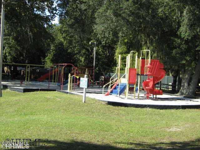 view of jungle gym featuring a lawn