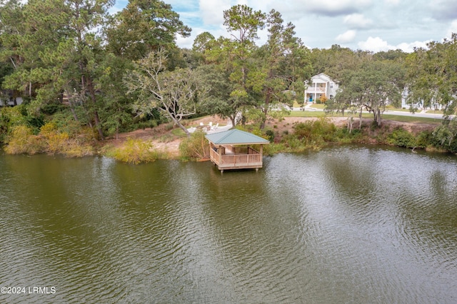 view of dock with a gazebo and a water view