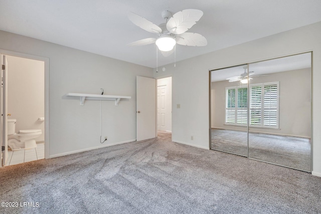 unfurnished bedroom with baseboards, a ceiling fan, and carpet flooring