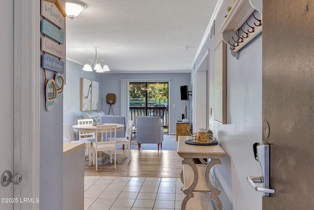 40 Folly Field Rd Unit G1, Hilton Head Island, SC 29928 - dining area with light tile patterned floors, ornamental molding, and a chandelier