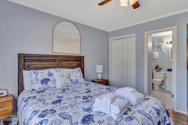 40 Folly Field Rd Unit G1, Hilton Head Island, SC 29928 - bedroom featuring ornamental molding, a closet, wood finished floors, ensuite bathroom, and ceiling fan