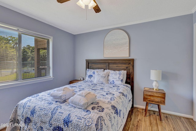 40 Folly Field Rd Unit G1, Hilton Head Island, SC 29928 - bedroom featuring wood finished floors, crown molding, and a ceiling fan