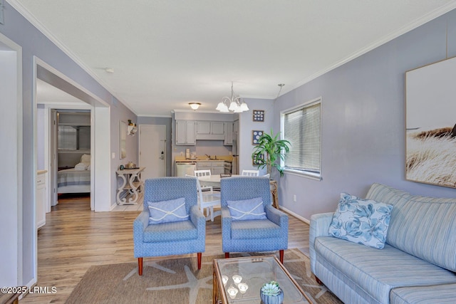 40 Folly Field Rd Unit G1, Hilton Head Island, SC 29928 - living area featuring a chandelier, light wood-type flooring, and ornamental molding