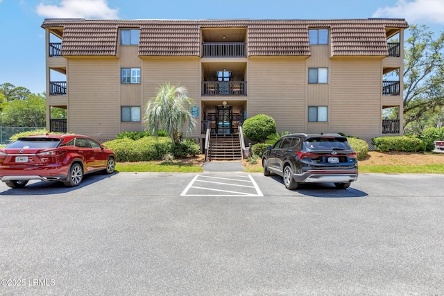 40 Folly Field Rd Unit G1, Hilton Head Island, SC 29928 - view of building exterior with uncovered parking and stairs