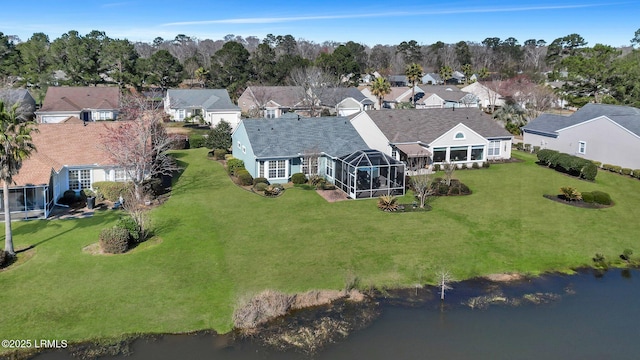 bird's eye view with a water view and a residential view