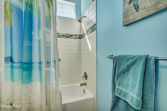 bathroom with shower / tub combo with curtain