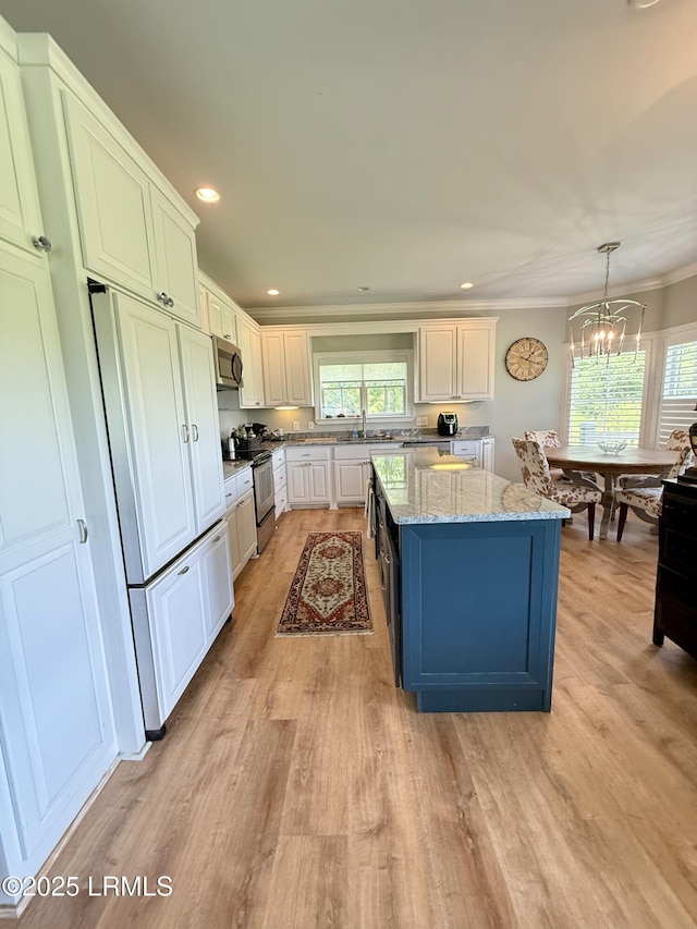 189 Deloss Point Rd, Ridgeland, SC 29936 - kitchen featuring light wood finished floors, a chandelier, stainless steel appliances, light stone counters, and ornamental molding