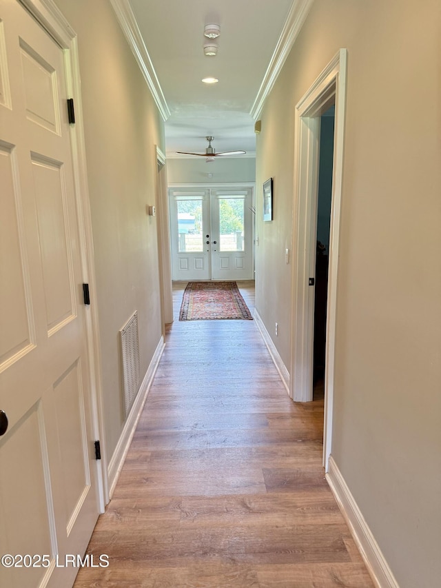 189 Deloss Point Rd, Ridgeland, SC 29936 - corridor featuring crown molding, wood finished floors, and french doors