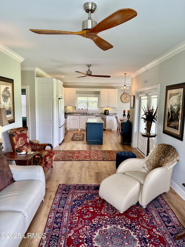 189 Deloss Point Rd, Ridgeland, SC 29936 - living room featuring light wood finished floors, ceiling fan, and crown molding