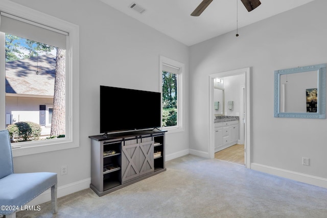 living room with ceiling fan and light carpet