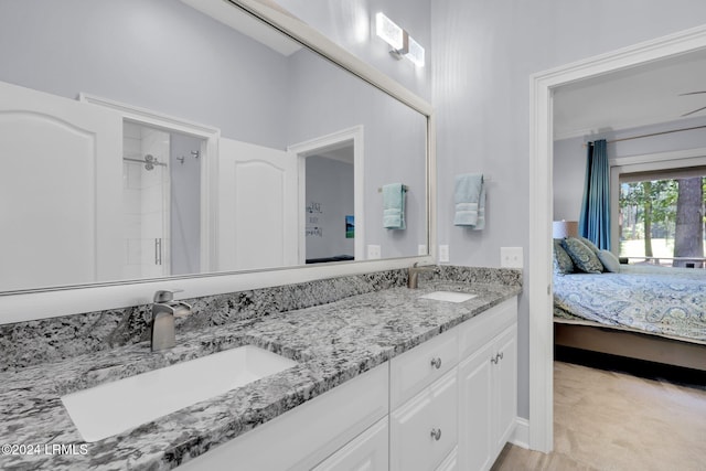 bathroom featuring vanity and a shower