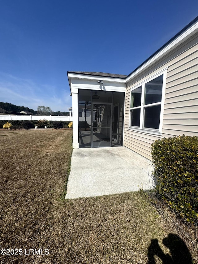 exterior space featuring a patio area and a sunroom