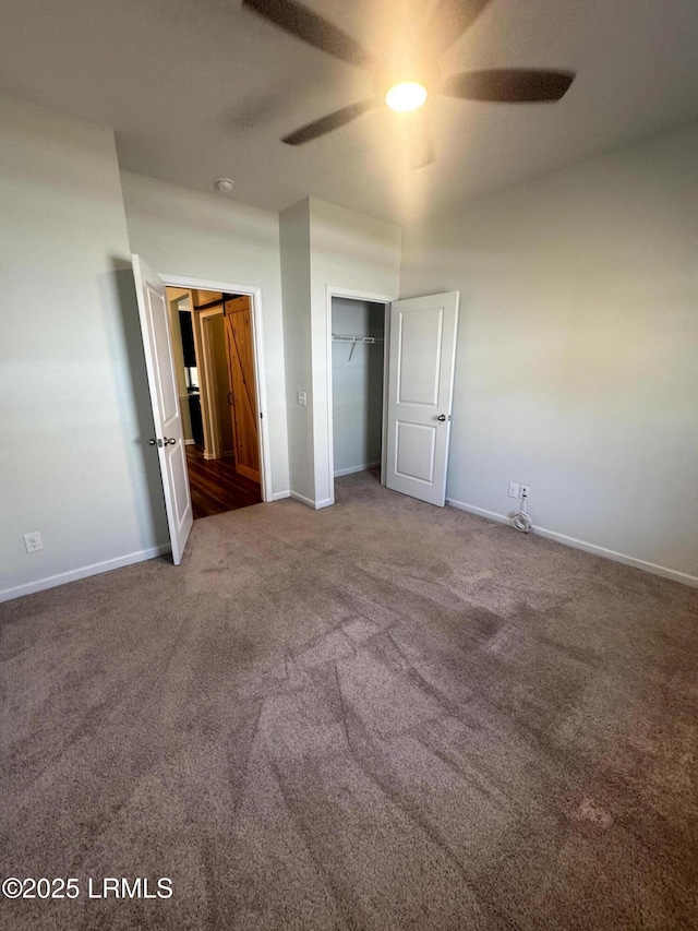 unfurnished bedroom with ceiling fan, baseboards, and carpet floors