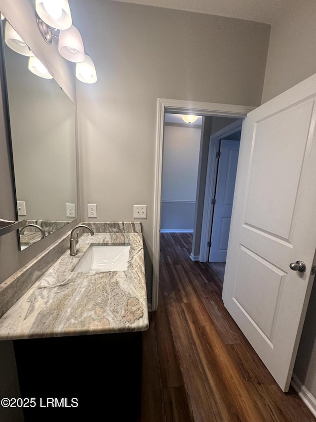 bathroom featuring wood finished floors and vanity