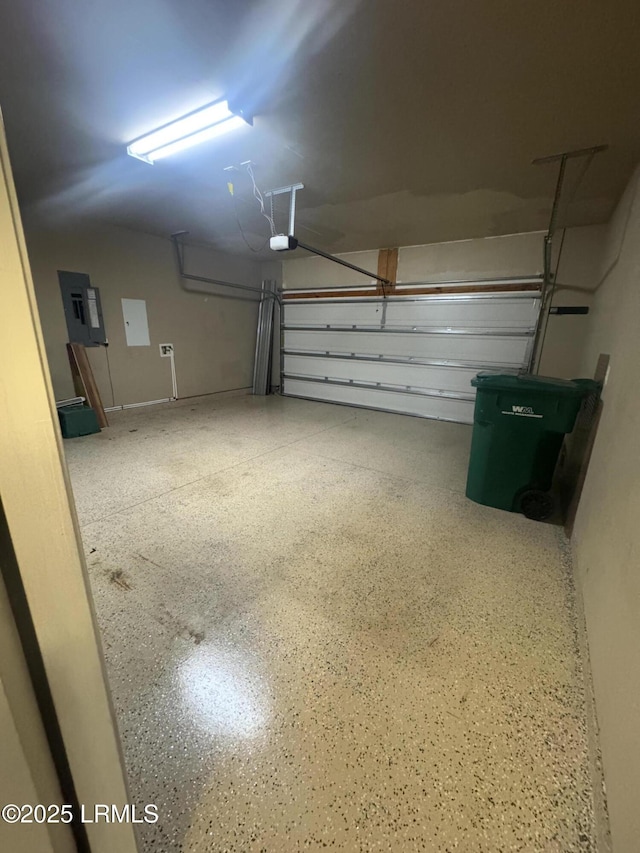 garage with electric panel and a garage door opener