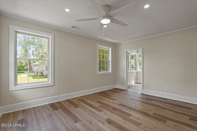 1730 Battery Park Dr, Port Royal, SC 29935 - spare room featuring wood finished floors, crown molding, a ceiling fan, and recessed lighting
