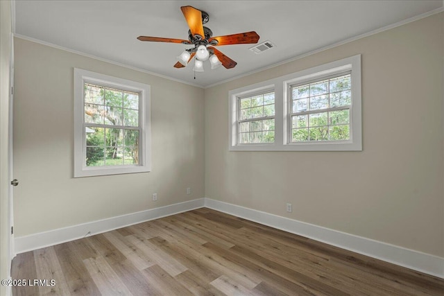 1730 Battery Park Dr, Port Royal, SC 29935 - unfurnished room featuring plenty of natural light, wood finished floors, crown molding, and a ceiling fan