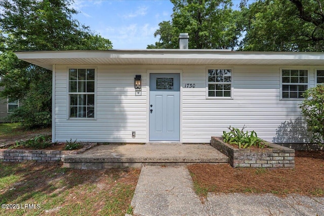 1730 Battery Park Dr, Port Royal, SC 29935 - view of exterior entry with a chimney