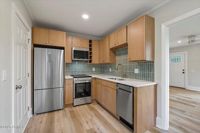 1730 Battery Park Dr, Port Royal, SC 29935 - kitchen with stainless steel appliances, light wood finished floors, light countertops, decorative backsplash, and recessed lighting