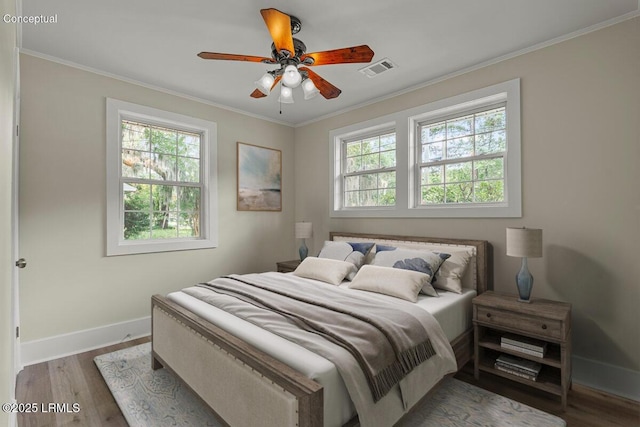 1730 Battery Park Dr, Port Royal, SC 29935 - bedroom with multiple windows, wood finished floors, and ornamental molding