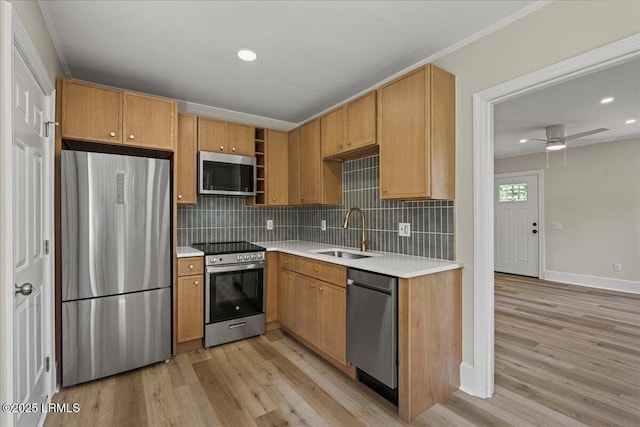 1730 Battery Park Dr, Port Royal, SC 29935 - kitchen with appliances with stainless steel finishes, light wood-type flooring, backsplash, light countertops, and recessed lighting