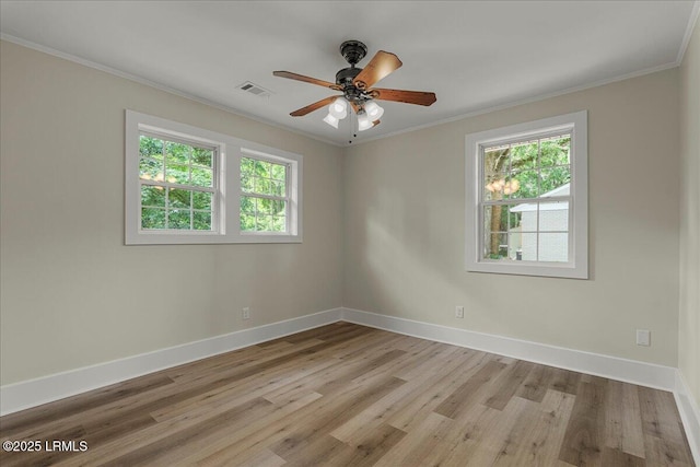 1730 Battery Park Dr, Port Royal, SC 29935 - spare room featuring light wood-style floors, ornamental molding, and ceiling fan