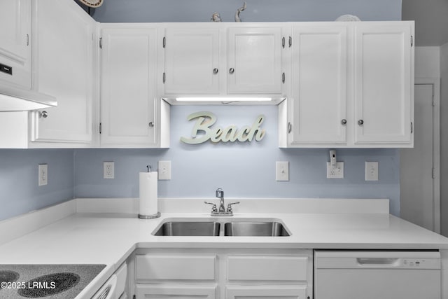 kitchen with white dishwasher, a sink, and white cabinets