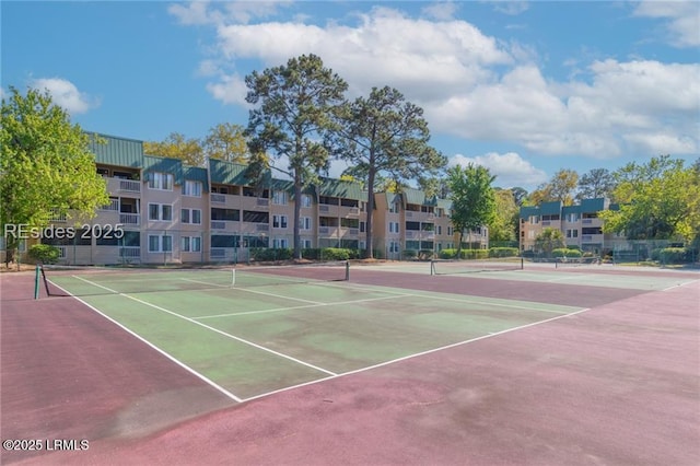 view of sport court featuring fence