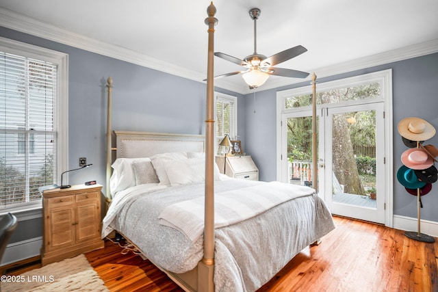 bedroom featuring ornamental molding, access to outside, baseboards, and wood finished floors