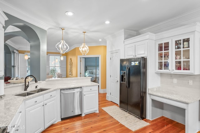 kitchen with white cabinets, dishwasher, glass insert cabinets, black refrigerator with ice dispenser, and a sink