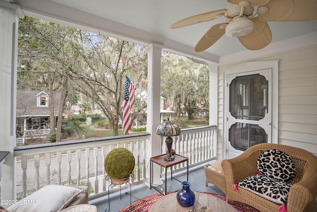 sunroom with a ceiling fan