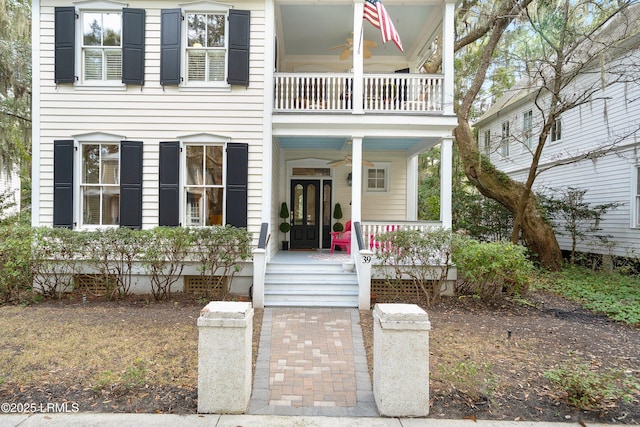 view of front of property with a ceiling fan, crawl space, a porch, and a balcony