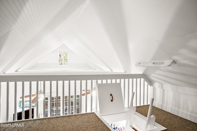 additional living space featuring lofted ceiling and carpet