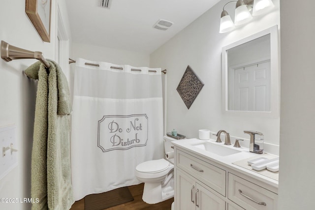 380 Marshland Rd Unit H34, Hilton Head Island, SC 29926 - full bathroom featuring wood finished floors, visible vents, toilet, vanity, and a shower with shower curtain