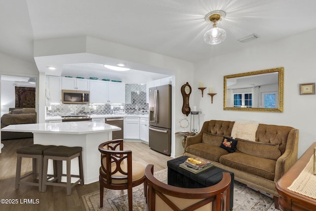 380 Marshland Rd Unit H34, Hilton Head Island, SC 29926 - living area with light wood-style flooring and visible vents