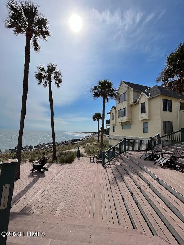 wooden deck featuring a water view