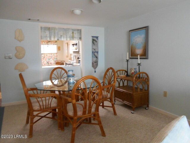 view of carpeted dining area