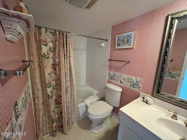 full bathroom with toilet, vanity, and shower / bathtub combination with curtain