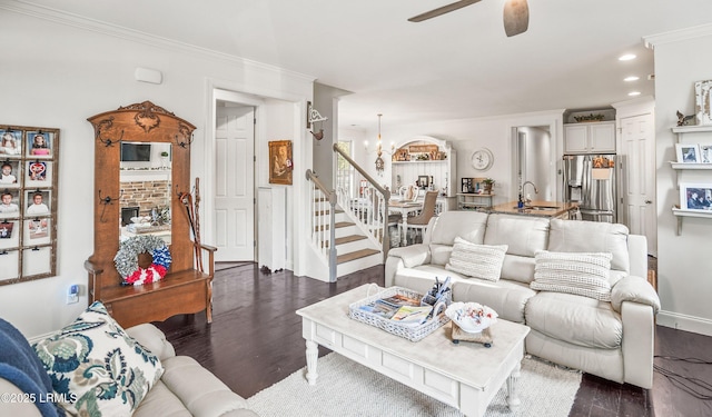 104 Grande Oaks, Beaufort, SC 29906 - living room featuring ceiling fan with notable chandelier, ornamental molding, dark hardwood / wood-style floors, and sink