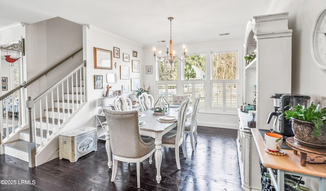 104 Grande Oaks, Beaufort, SC 29906 - dining room with dark hardwood / wood-style flooring, crown molding, and an inviting chandelier