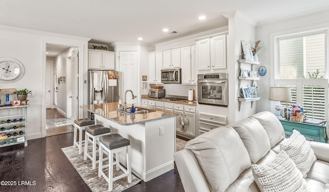 104 Grande Oaks, Beaufort, SC 29906 - kitchen with sink, stainless steel appliances, an island with sink, and white cabinets