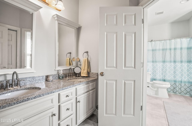104 Grande Oaks, Beaufort, SC 29906 - bathroom with walk in shower, tile patterned floors, vanity, and toilet