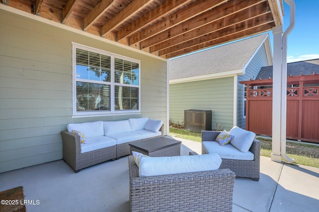 view of patio / terrace with fence and an outdoor hangout area